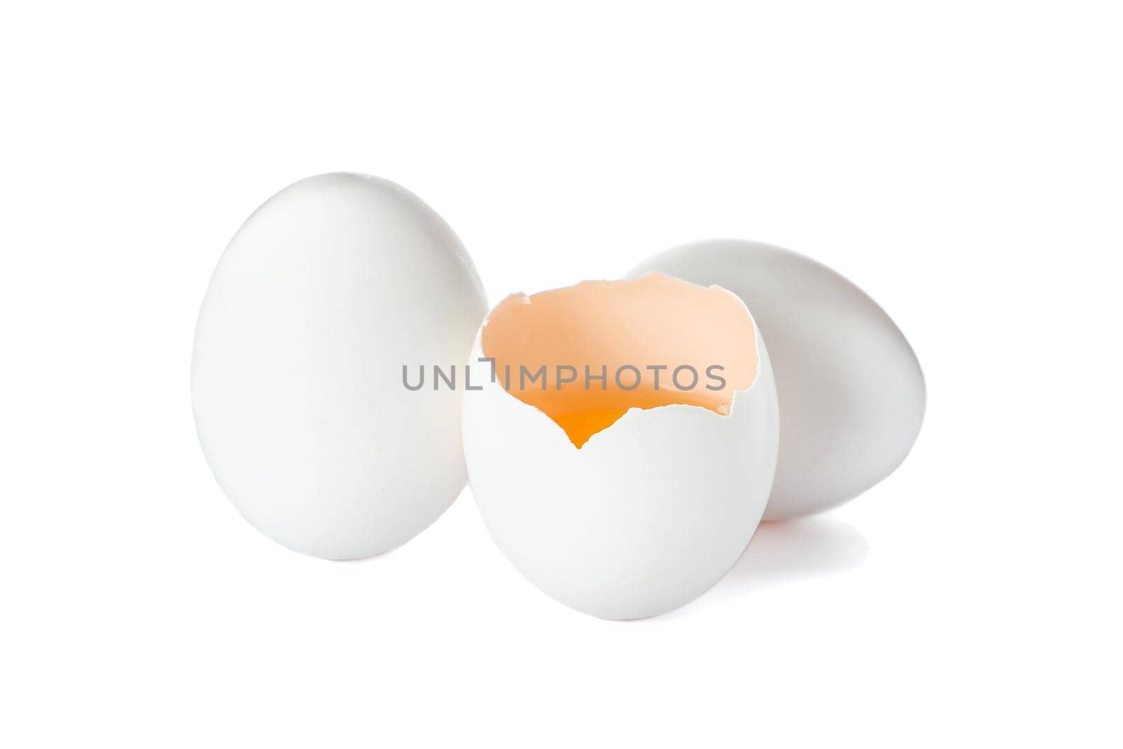 Chicken eggs and half yolk isolated on white background