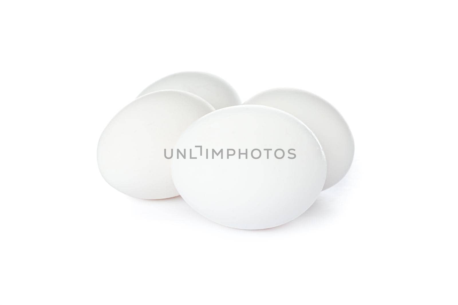 White chicken eggs isolated on white background by AtlasCompany