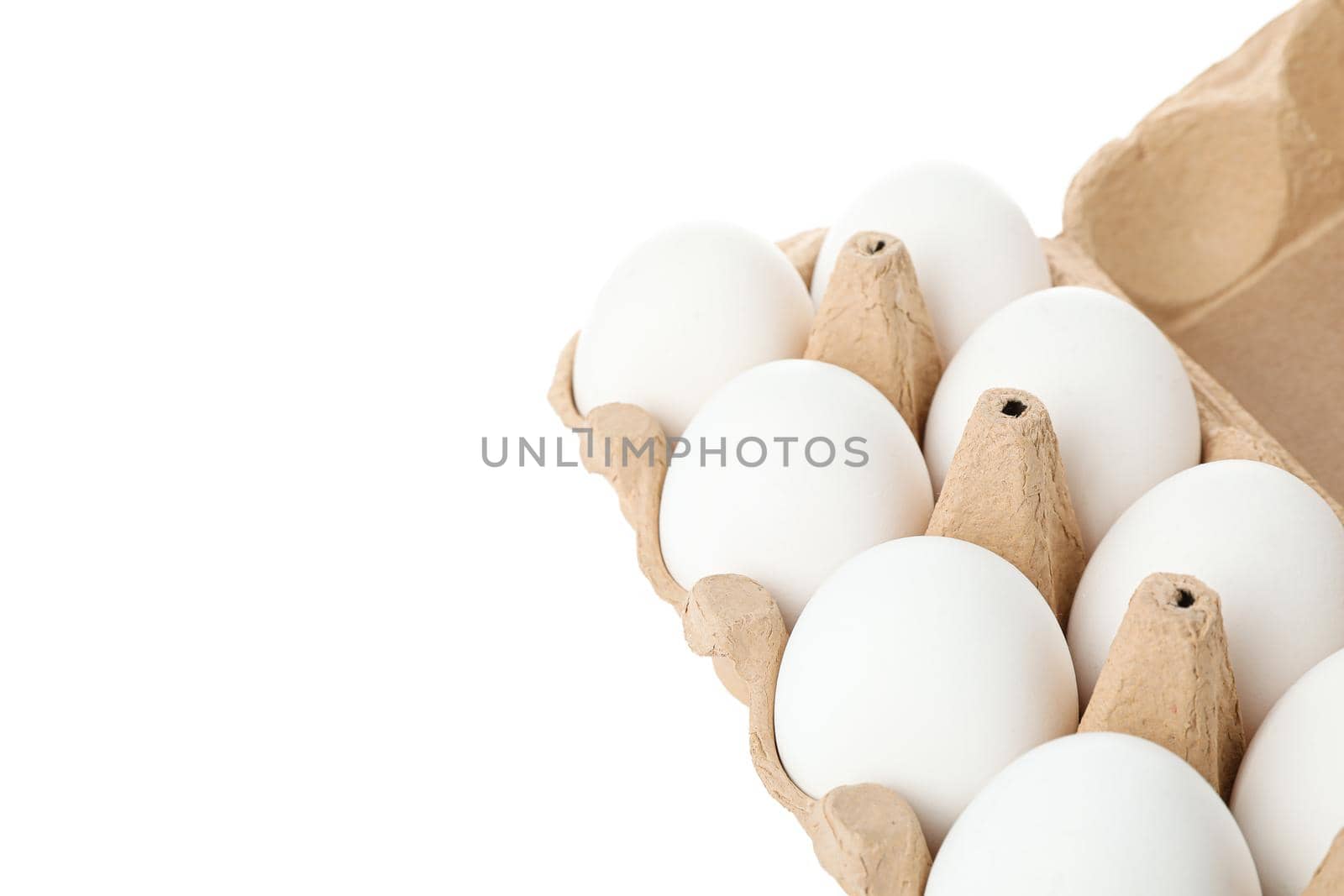 White chicken eggs in carton box isolated on white background by AtlasCompany