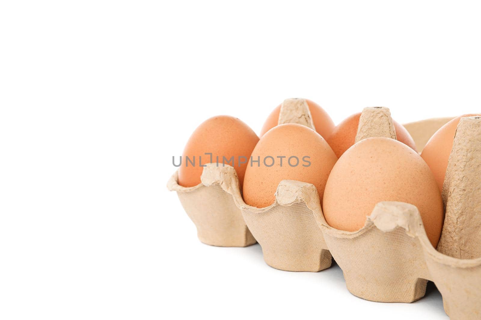 Brown chicken eggs in carton box isolated on white background by AtlasCompany