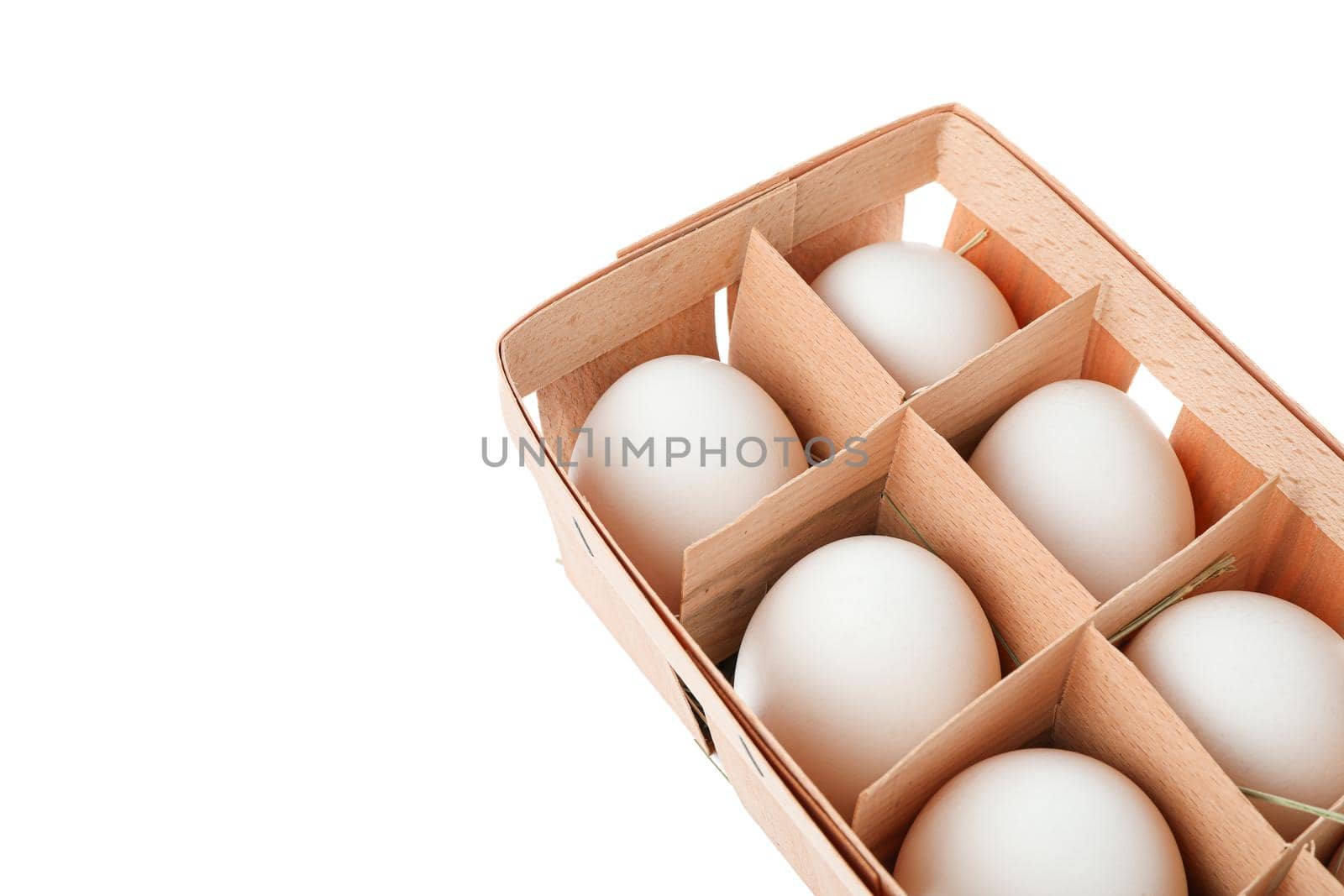 White chicken eggs in carton box isolated on white background