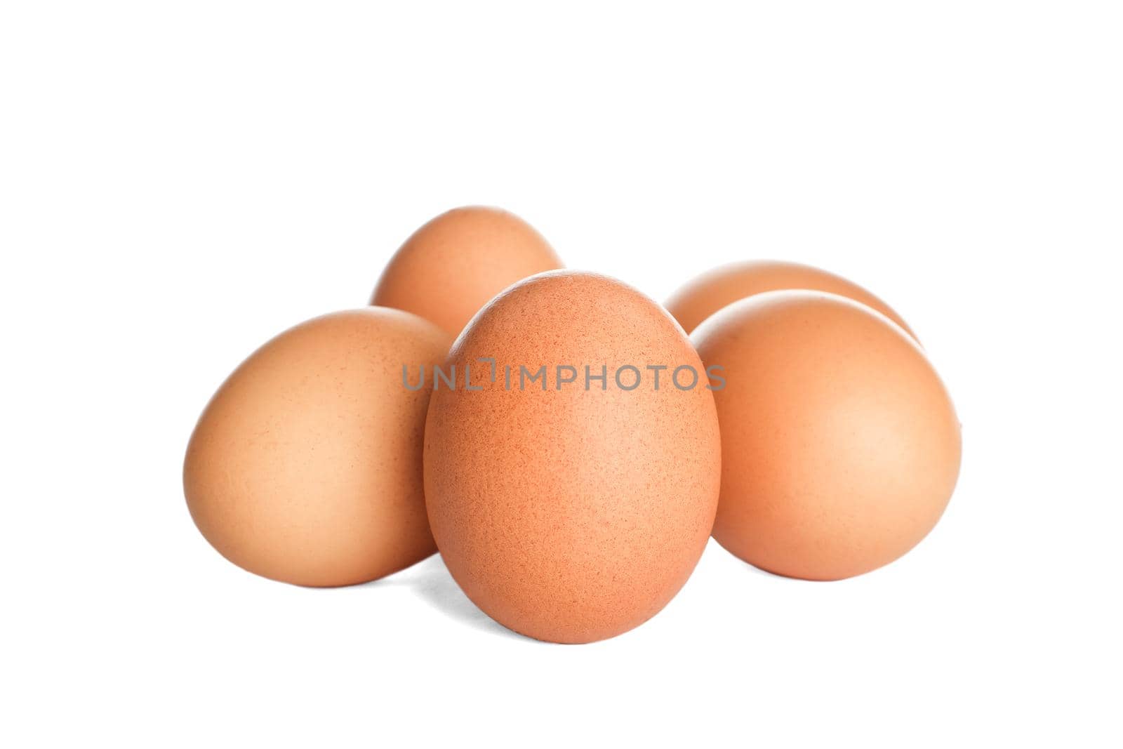 Few raw chicken eggs on white background by AtlasCompany