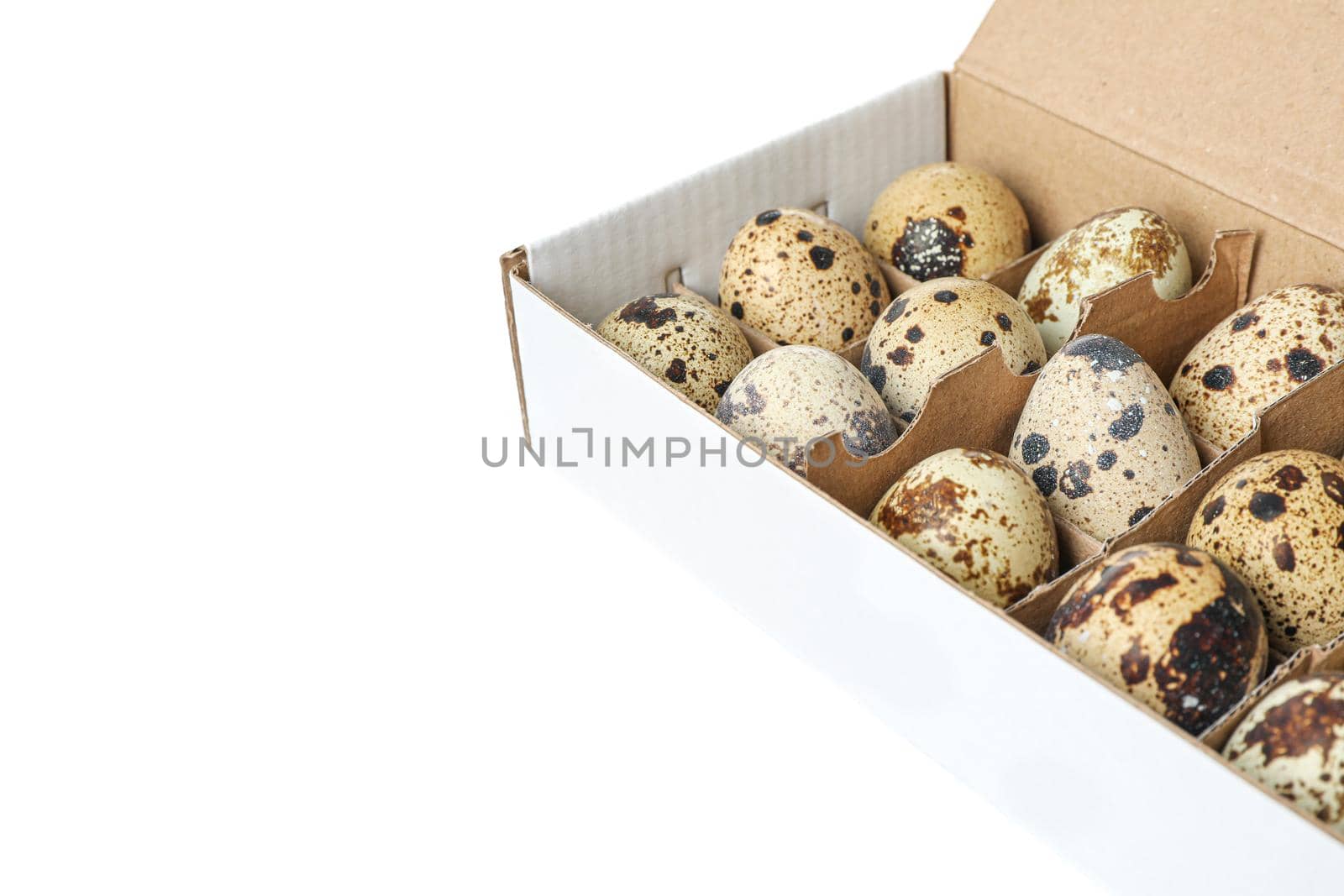 Quail eggs in carton box isolated on white background by AtlasCompany