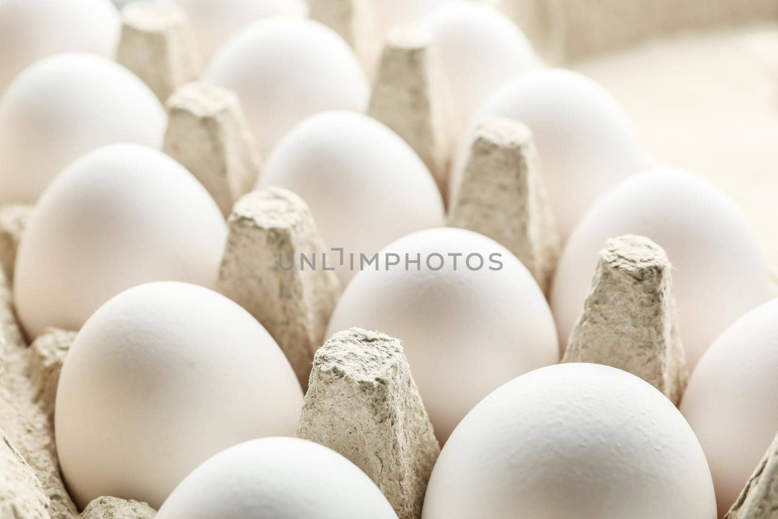 Chicken eggs in carton box as background, space for text by AtlasCompany