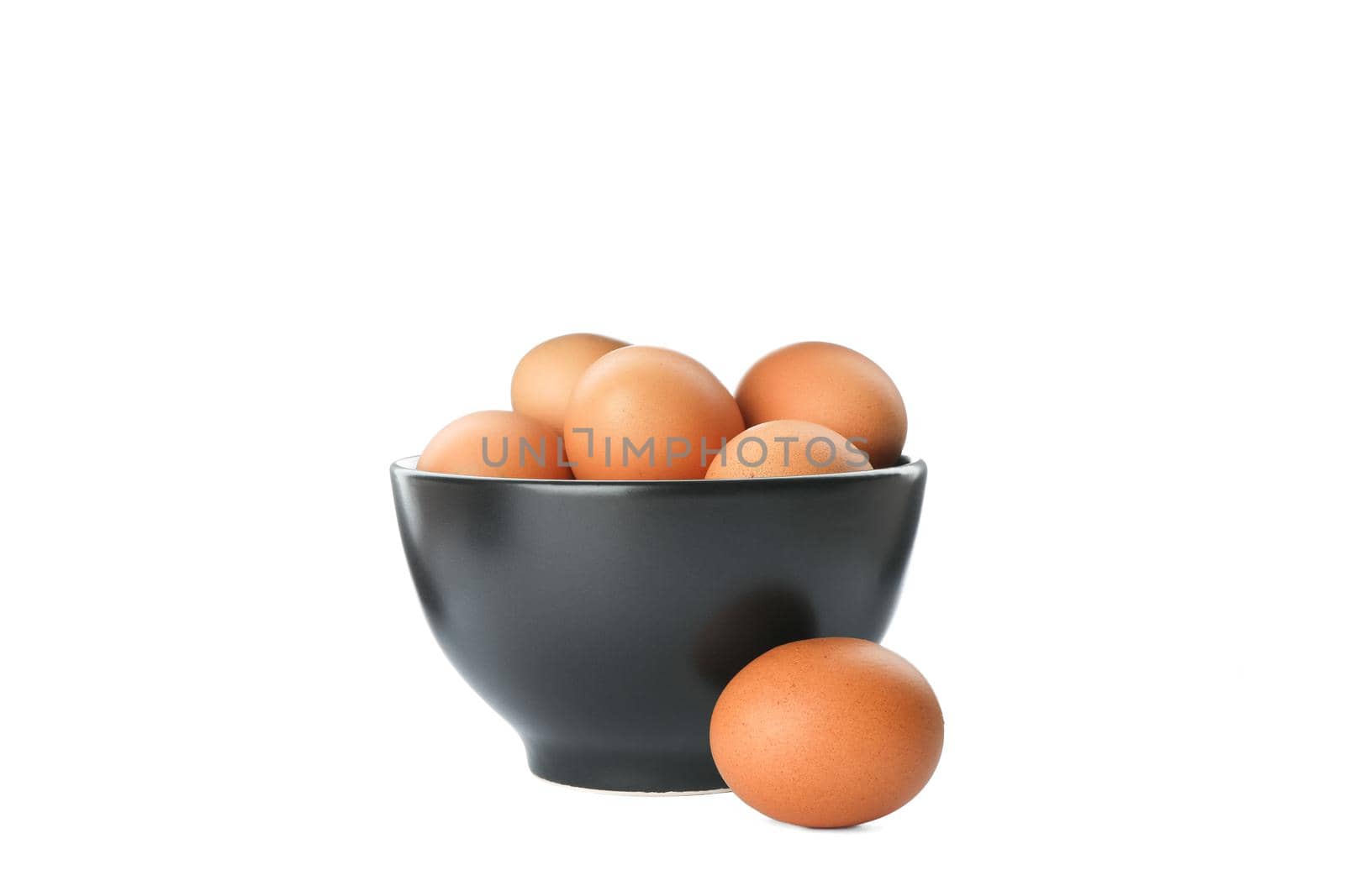 Few raw chicken eggs in bowl on white background