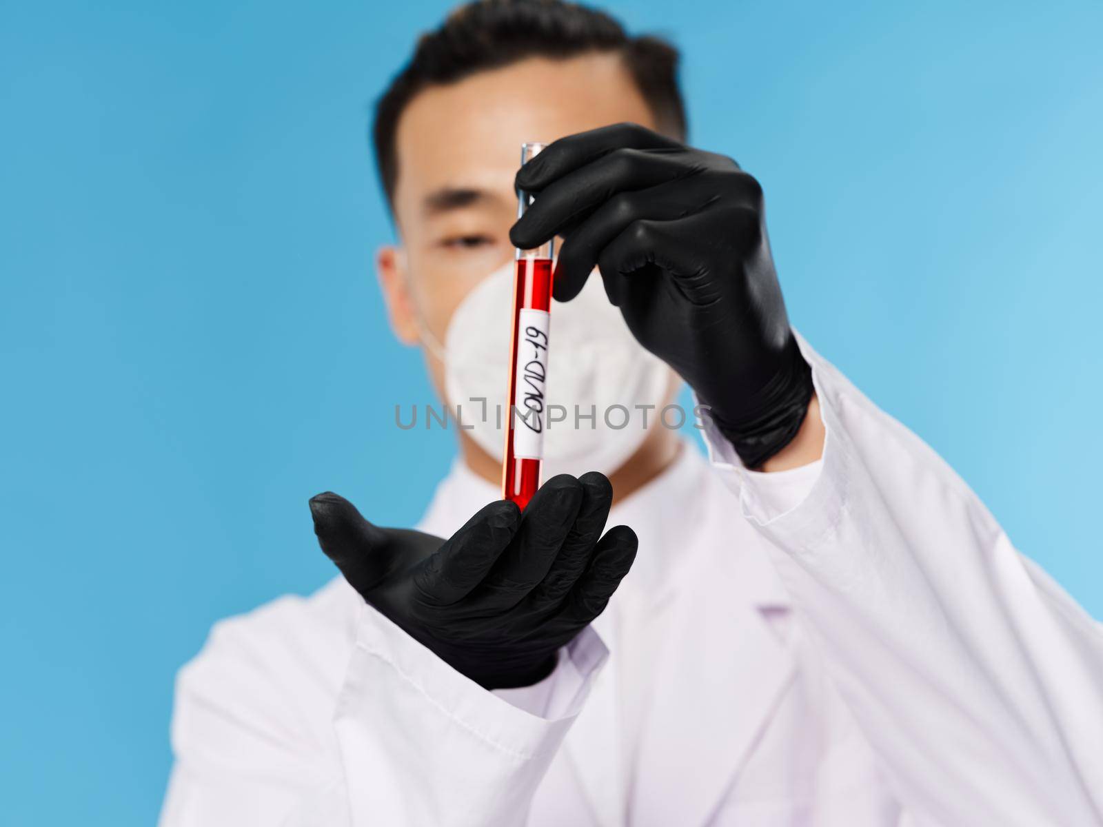 A man of Asian appearance. Laboratory blood test covid-19. High quality photo
