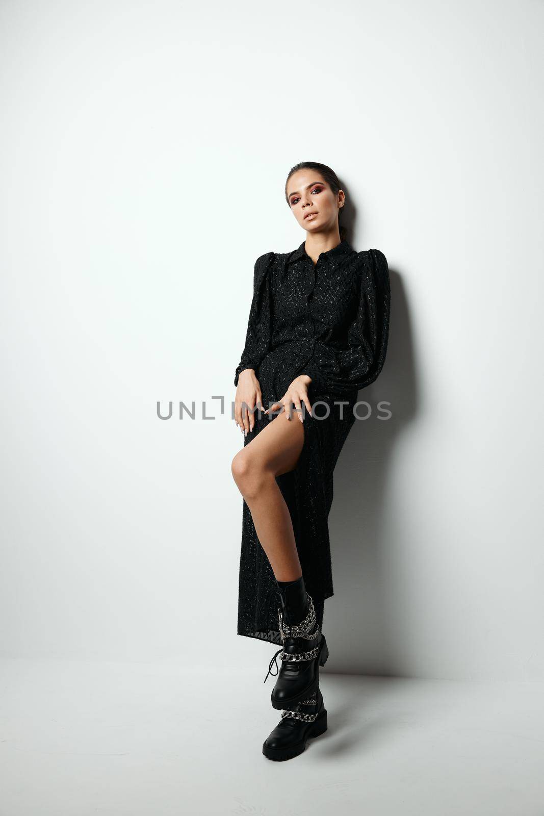 attractive brunette with bright makeup fashionable modern clothes black boots by SHOTPRIME