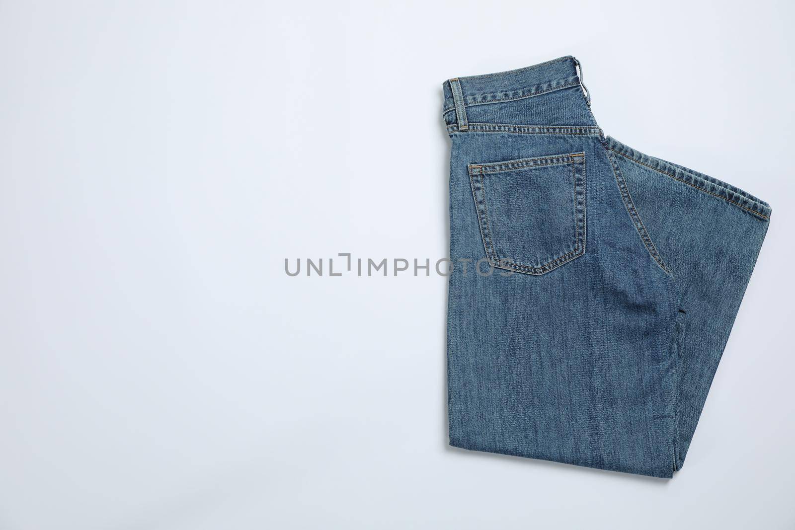 Jeans on white background, space for text by AtlasCompany
