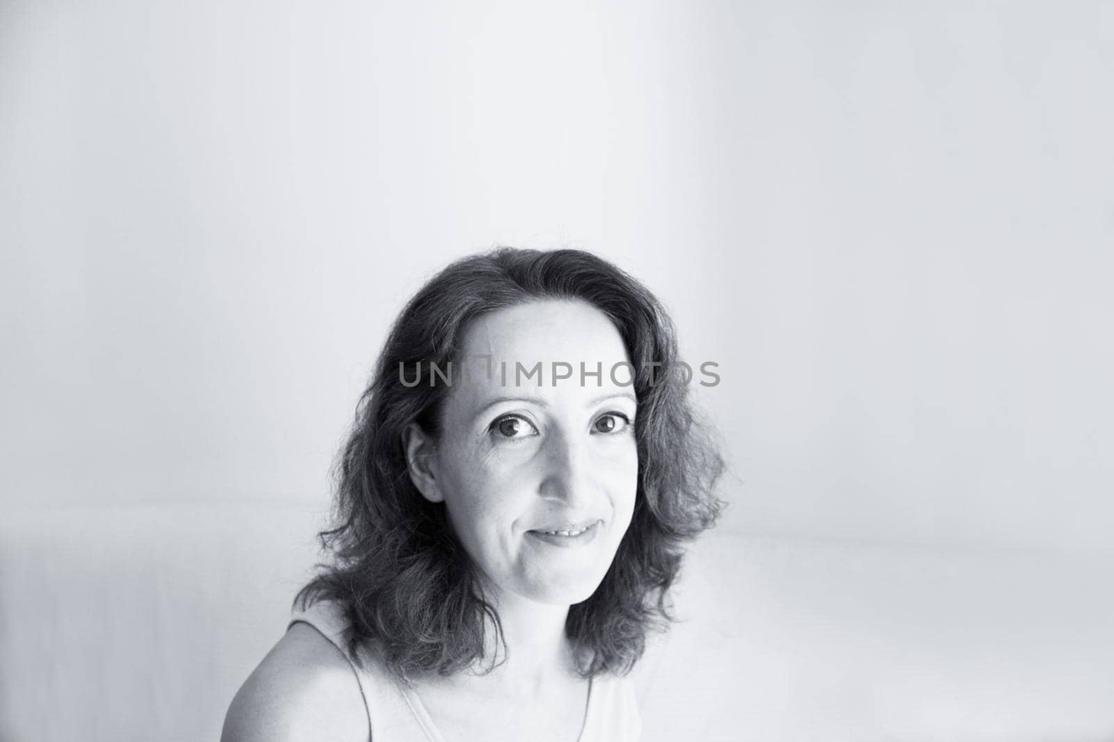 Portrait of woman with happy and positive expression. Copy space.