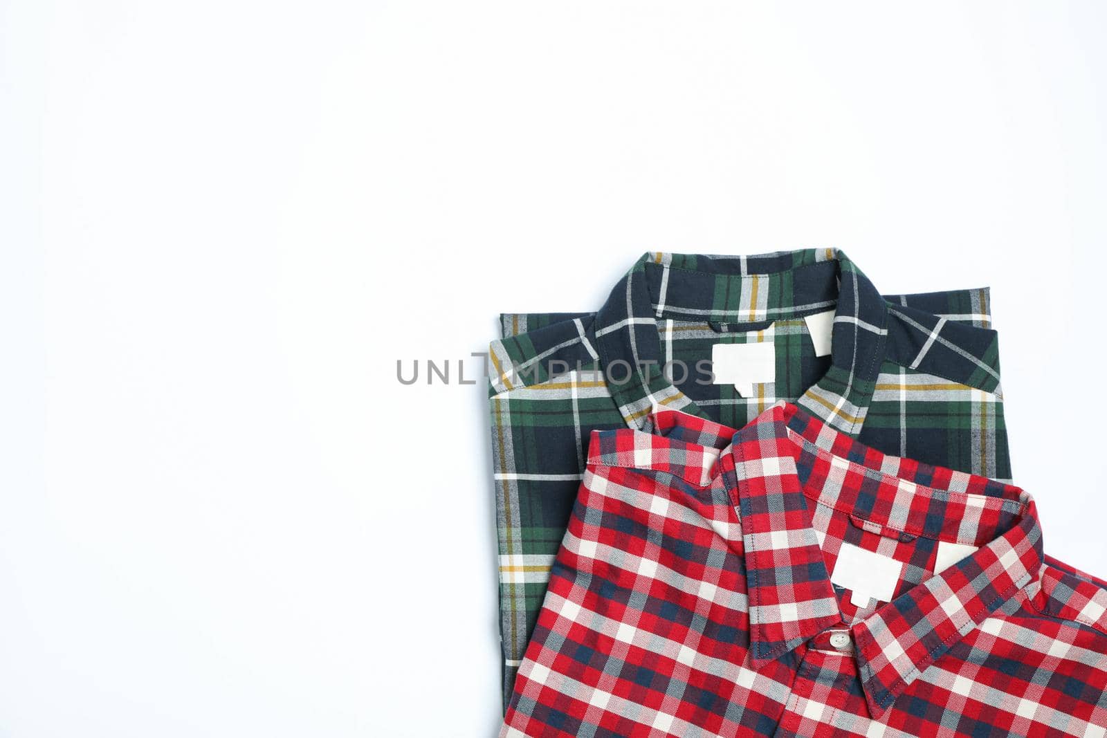 Different beautiful shirts on white background, copy space by AtlasCompany