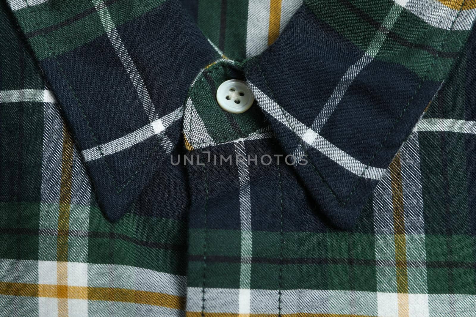 Checkered green shirt on whole background, close up