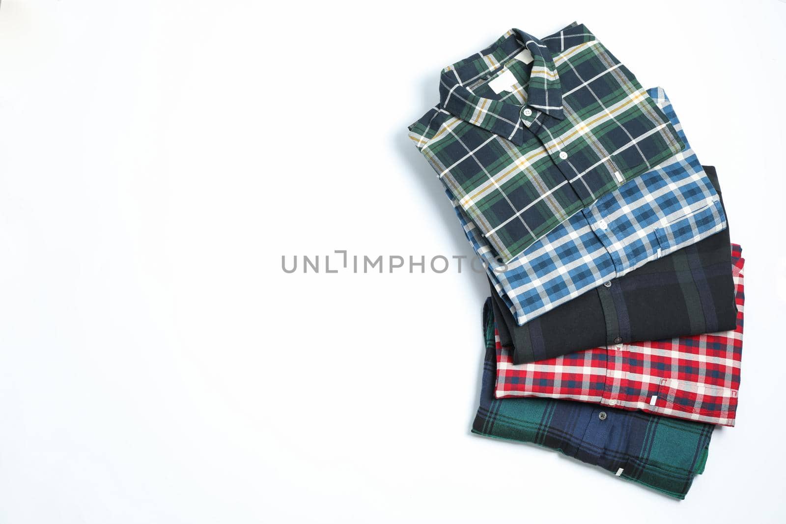 Different beautiful shirts on white background, space for text by AtlasCompany