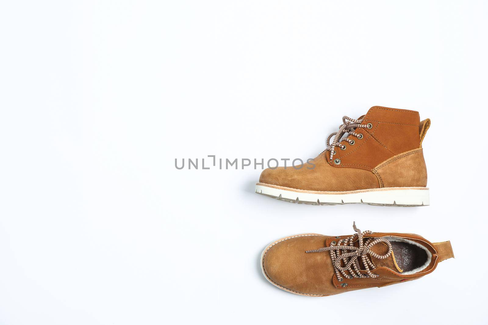 Winter boots on white background, top view by AtlasCompany