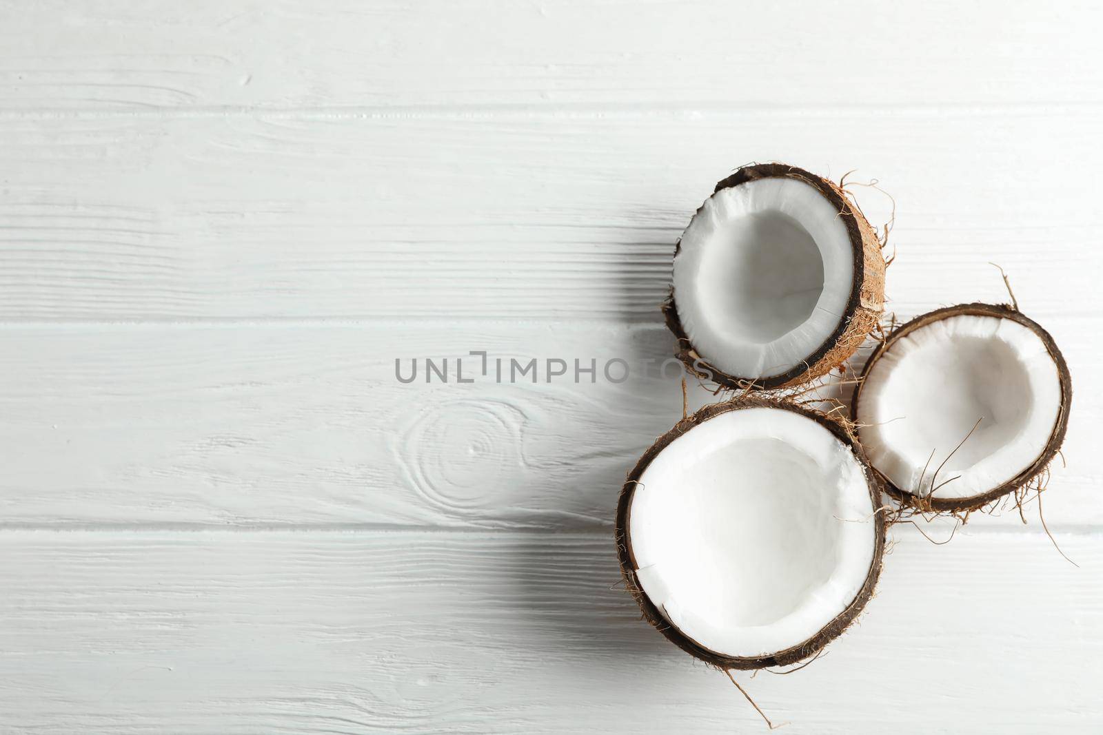 Tropical coconuts on white background, space for text