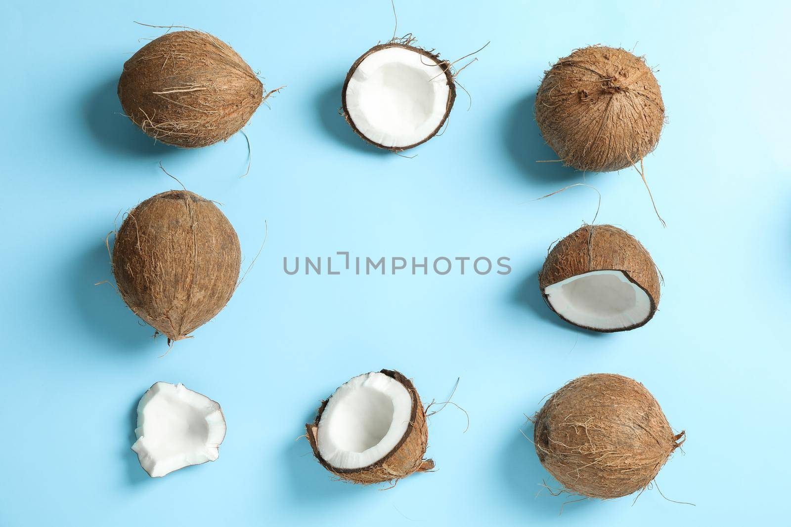 Flat lay composition with coconuts on color background, space for text by AtlasCompany