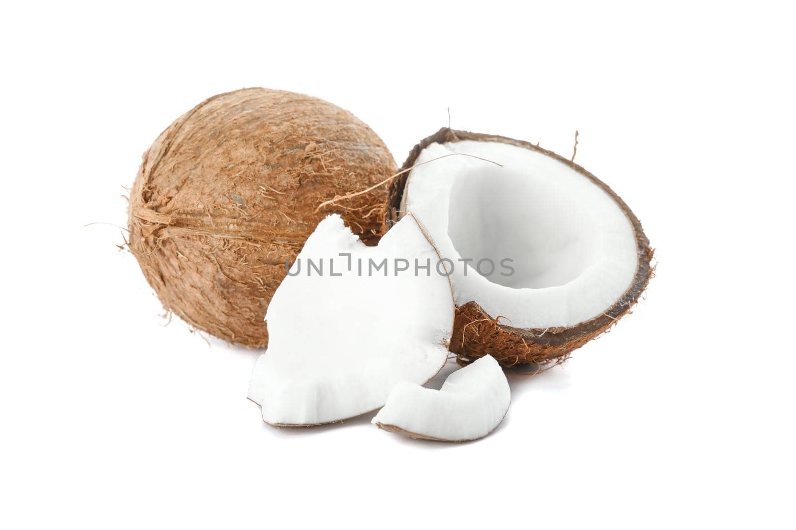 Two coconut one of which split isolated on white background by AtlasCompany