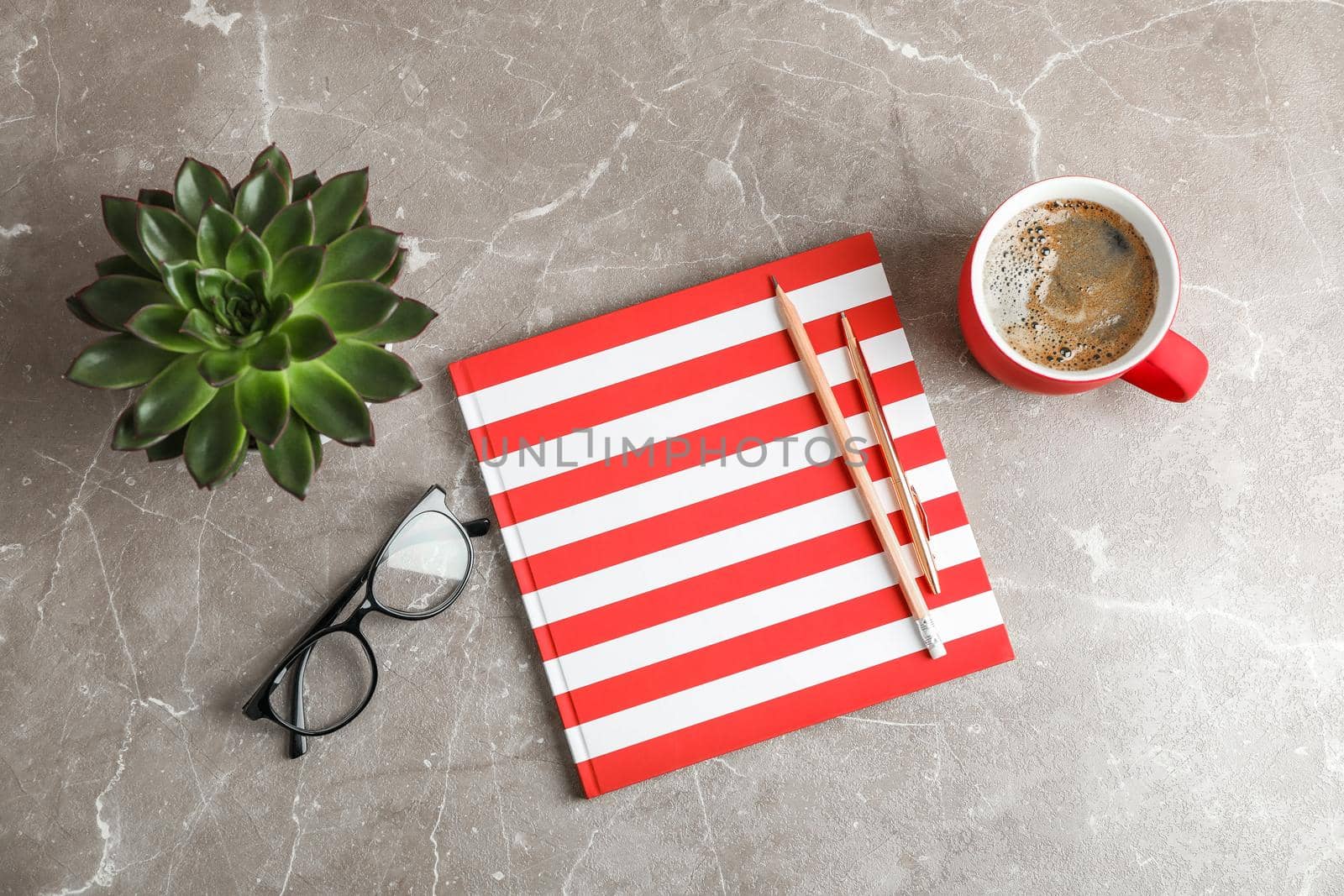 Flat lay composition with cup of coffee, copybook and succulent plant, top view by AtlasCompany