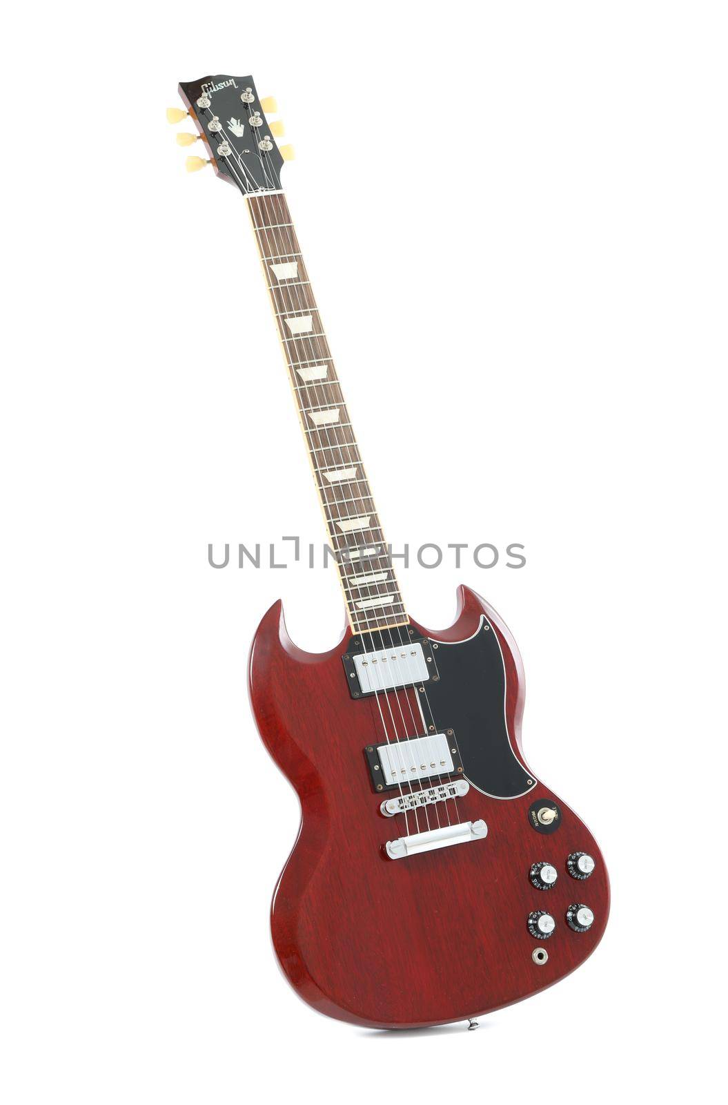 Beautiful six - string electric guitar isolated on white background by AtlasCompany