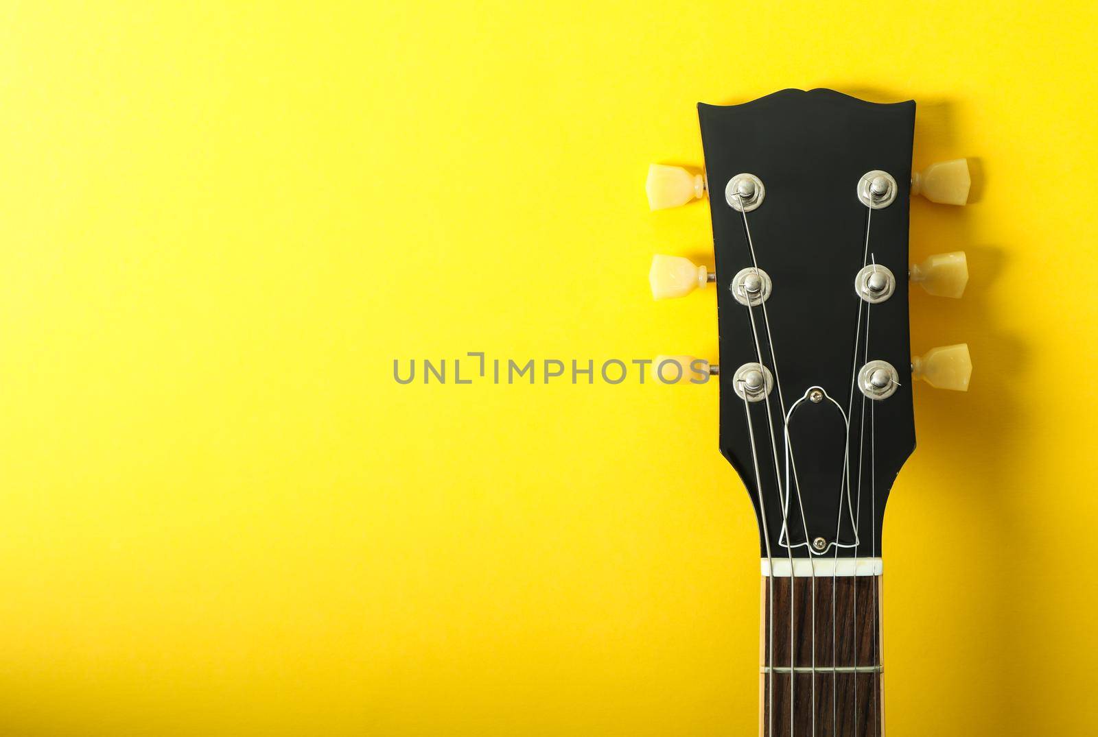 Neck head on yellow background, space for text by AtlasCompany