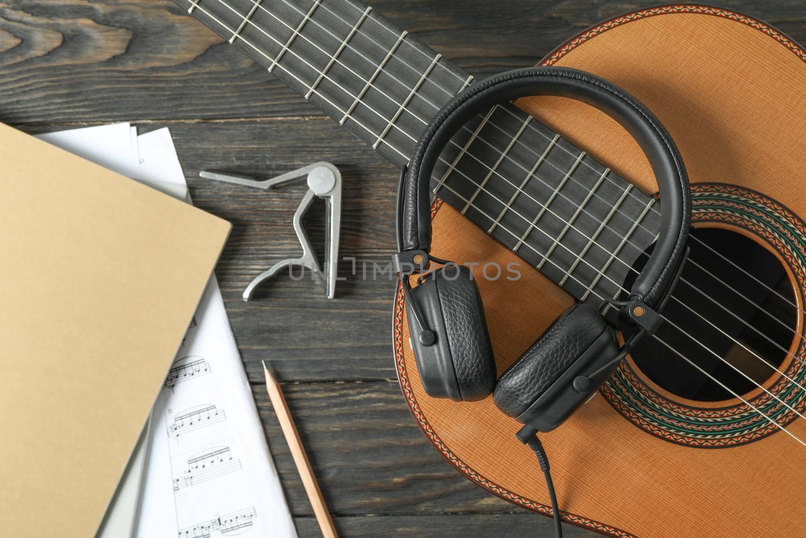 Music maker composition on wooden background, top view