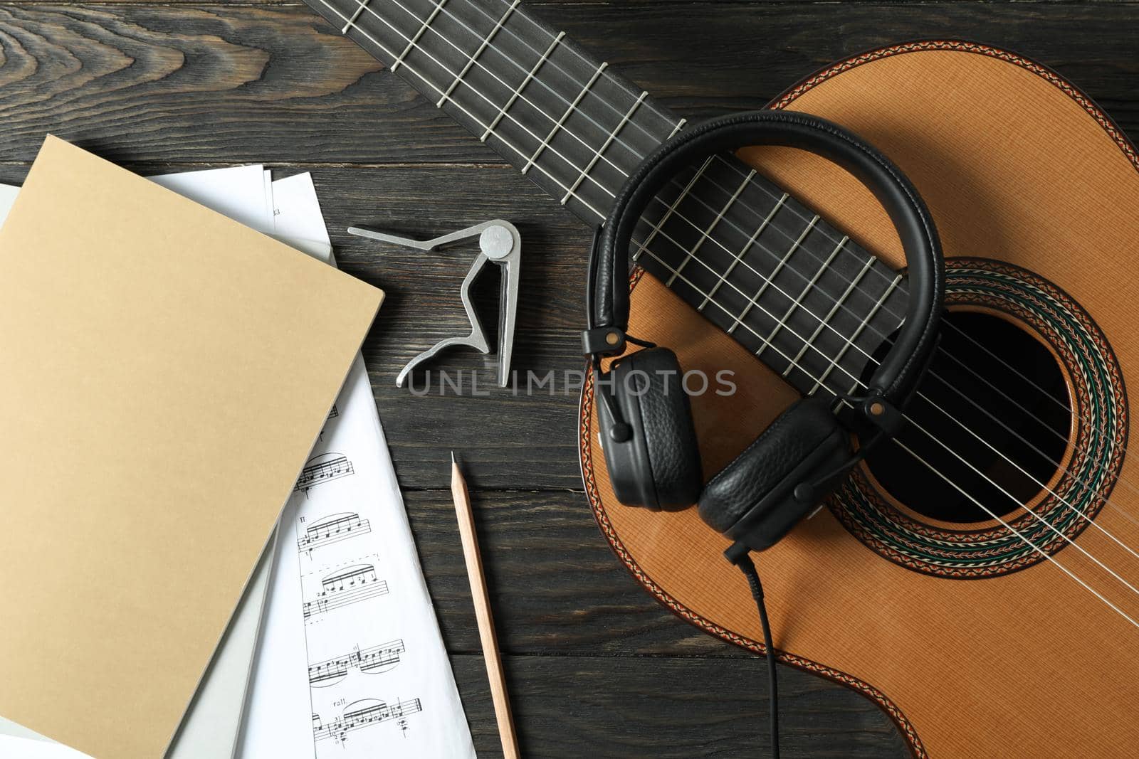 Music maker composition on wooden background, top view