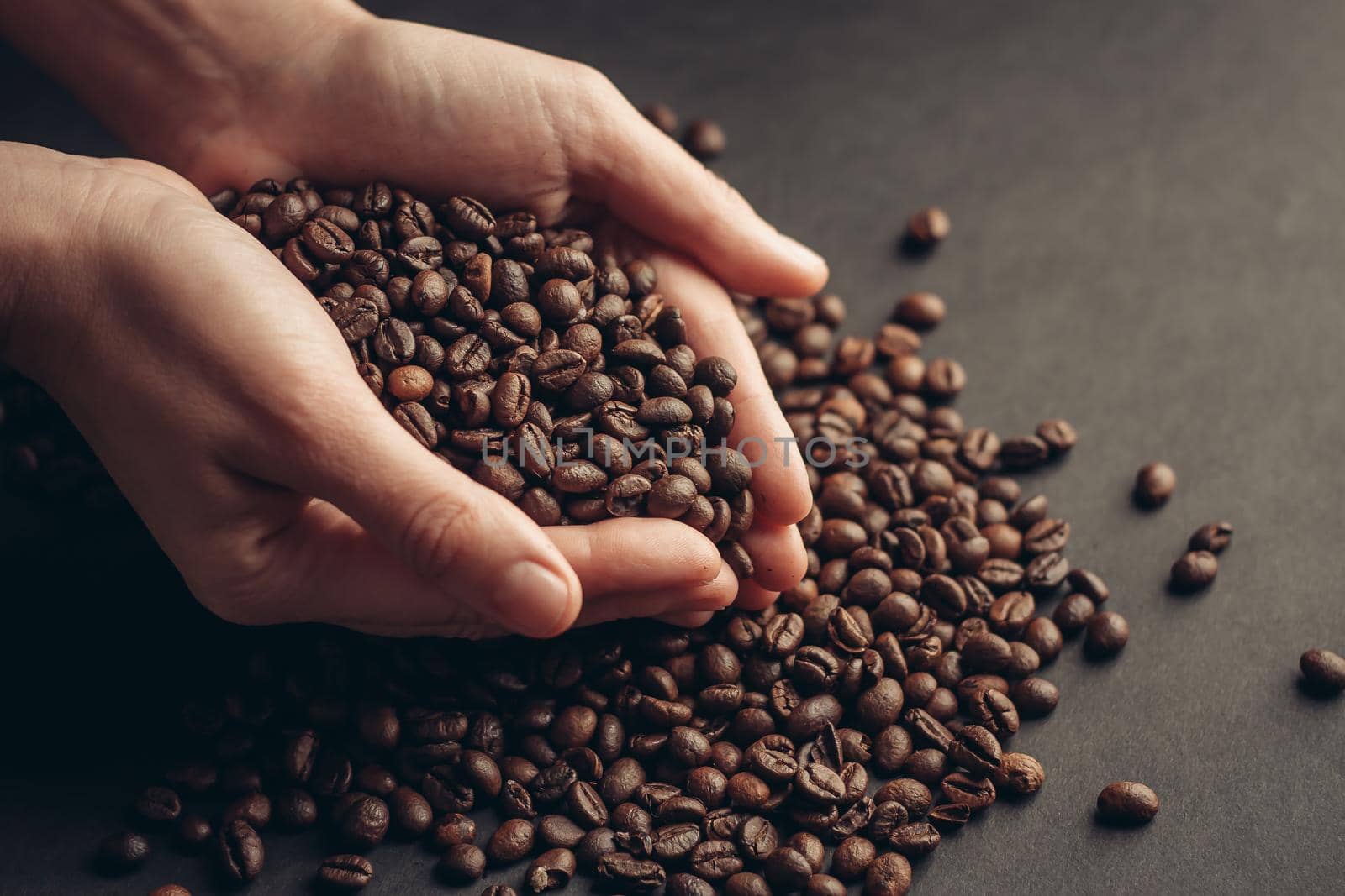 scattered grains on a dark background coffee aroma close-up organic by SHOTPRIME