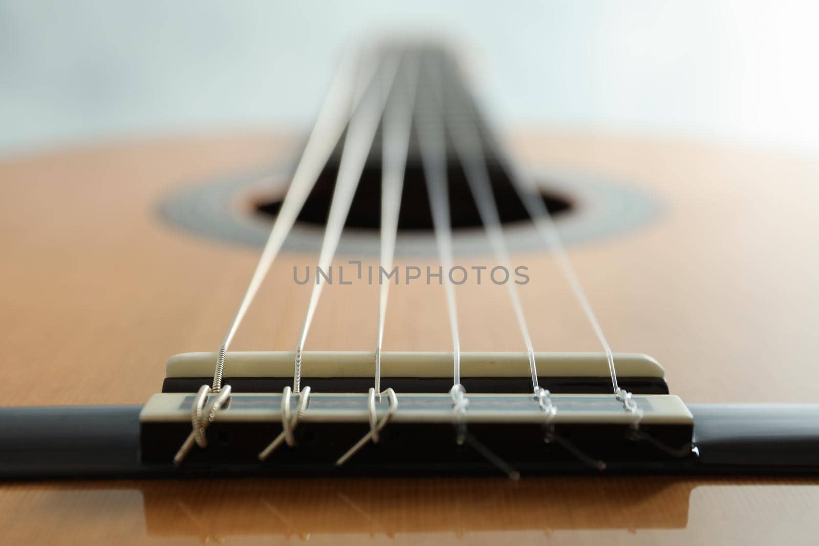 Beautiful six - string classic guitar on white background, closeup