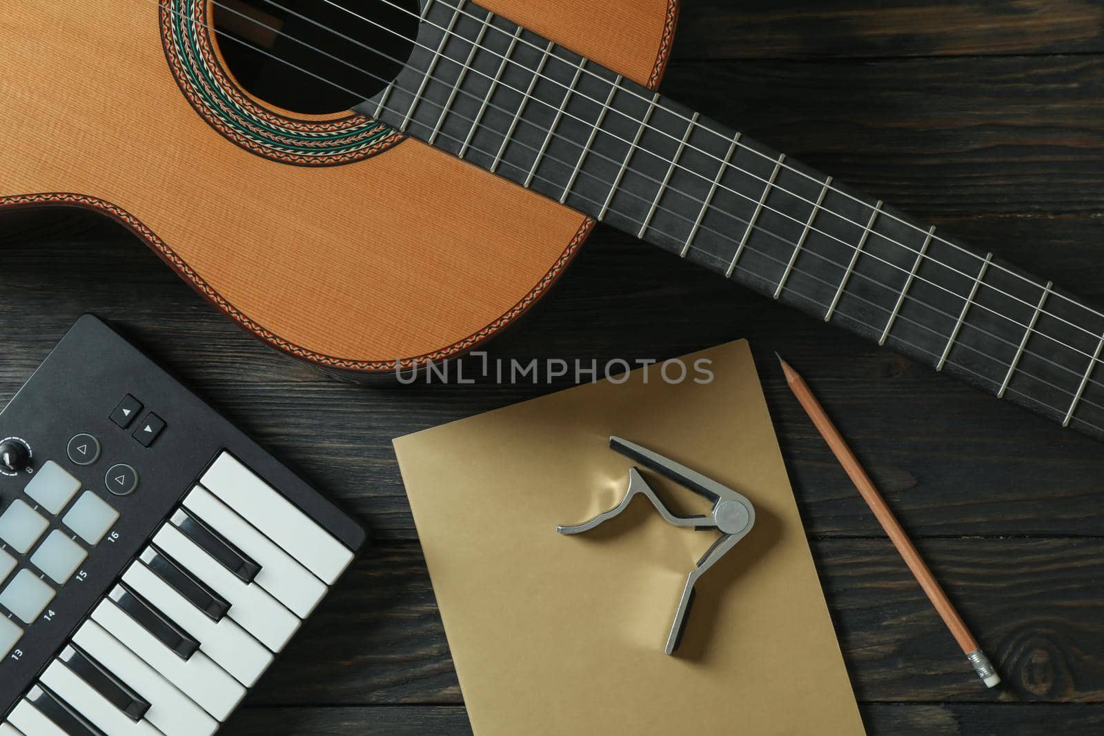 Music maker composition on wooden background, top view by AtlasCompany