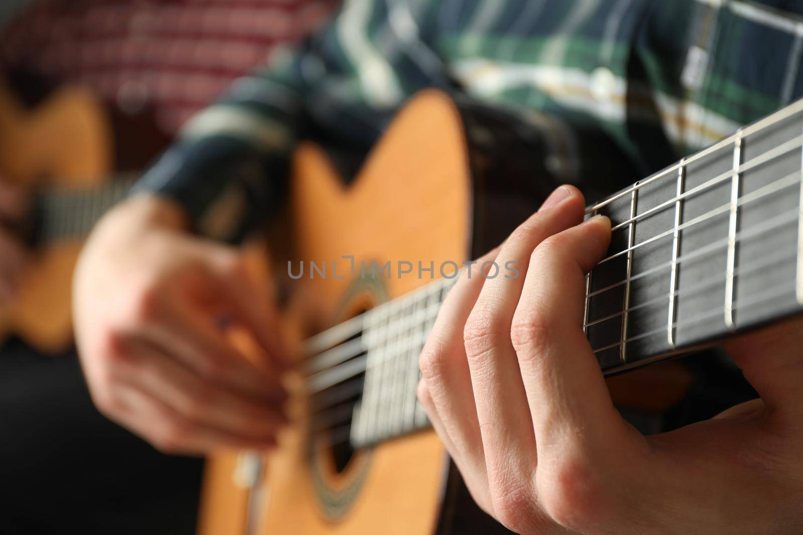 Two guitar players with classic guitars, space for text