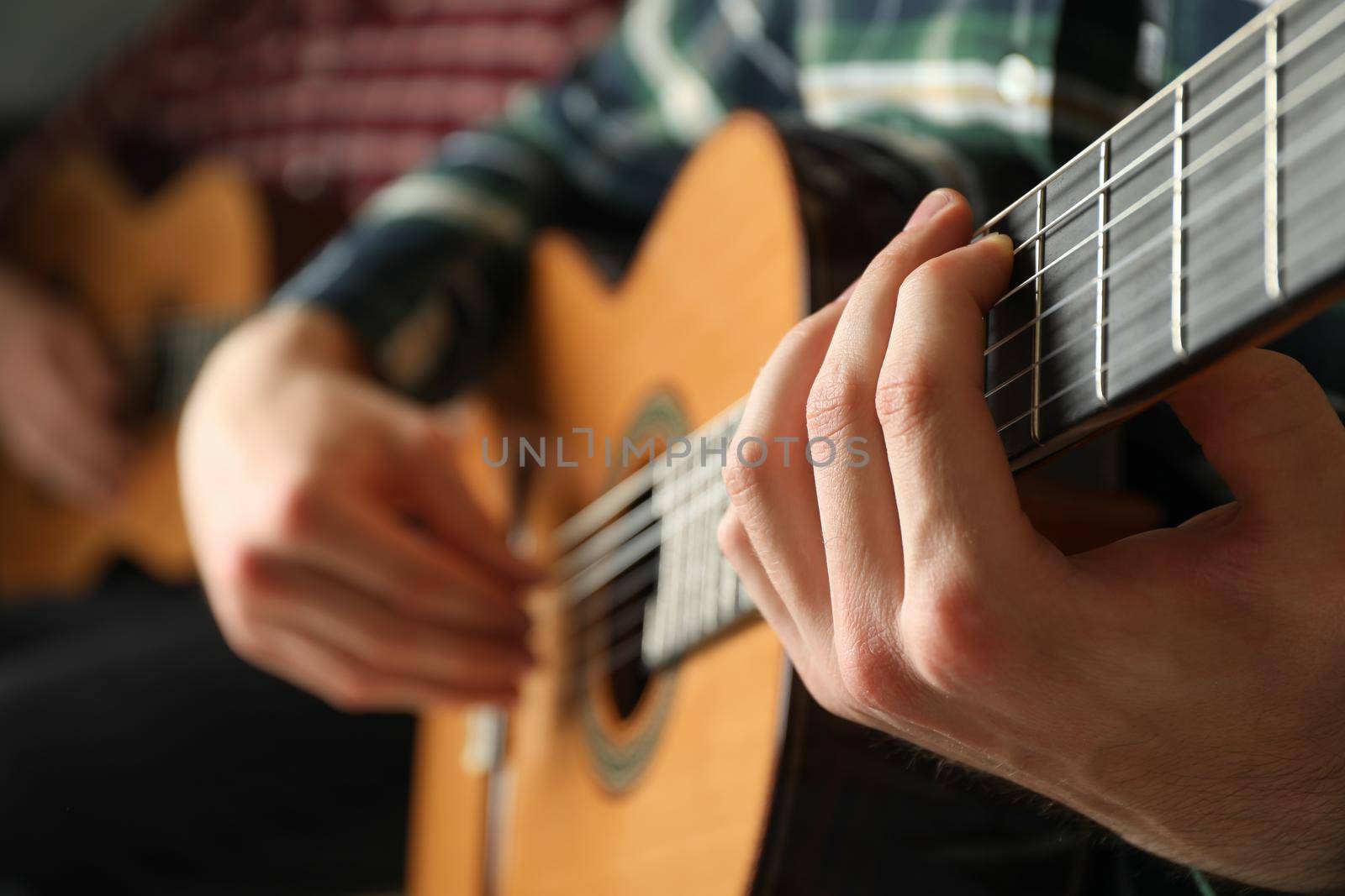 Two guitar players with classic guitars, space for text by AtlasCompany