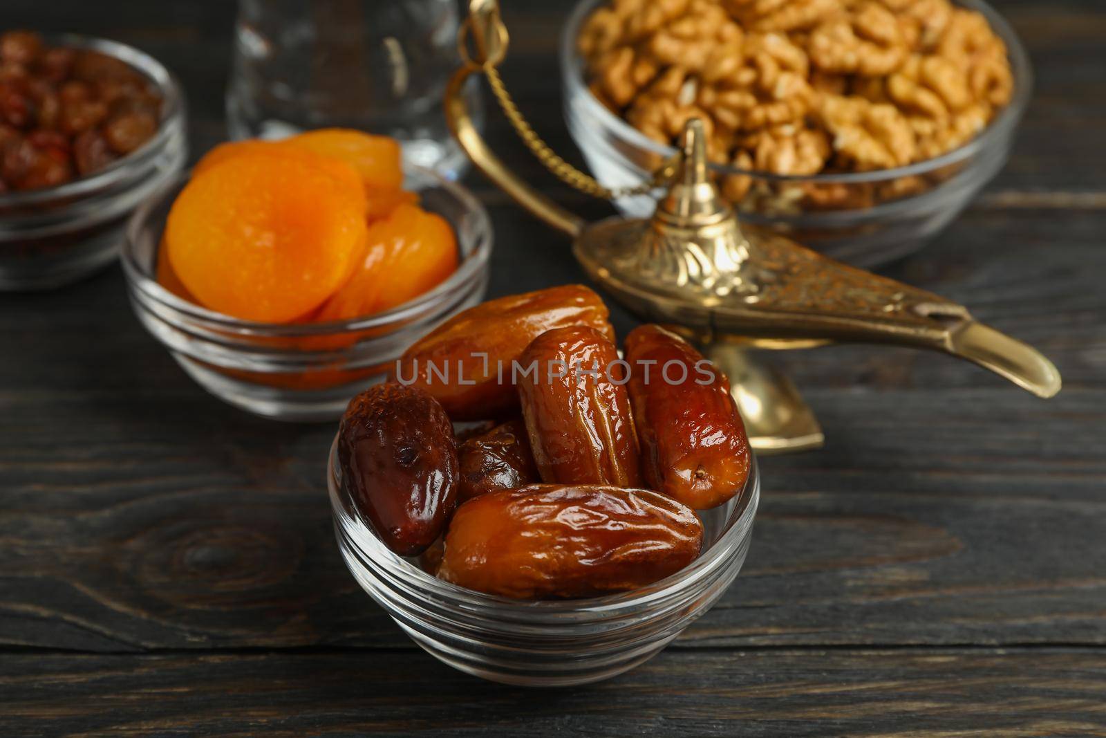 Ramadan Kareem food and decoration on wooden table, closeup by AtlasCompany