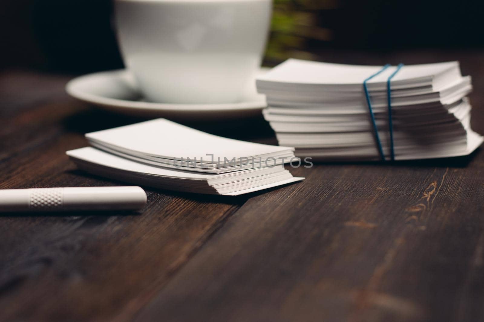coffee cup on the table business cards office desktop. High quality photo