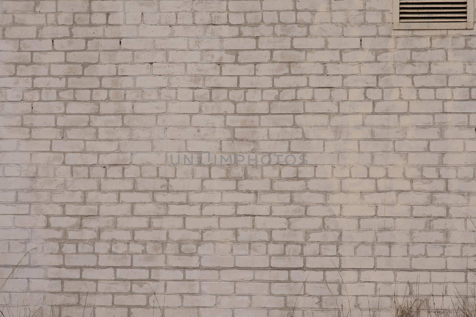 White brick wall and ventilation window. Horizontal. Texture