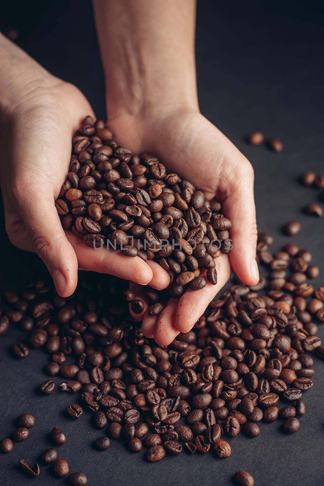 coffee beans in hands aroma morning vigor drink. High quality photo