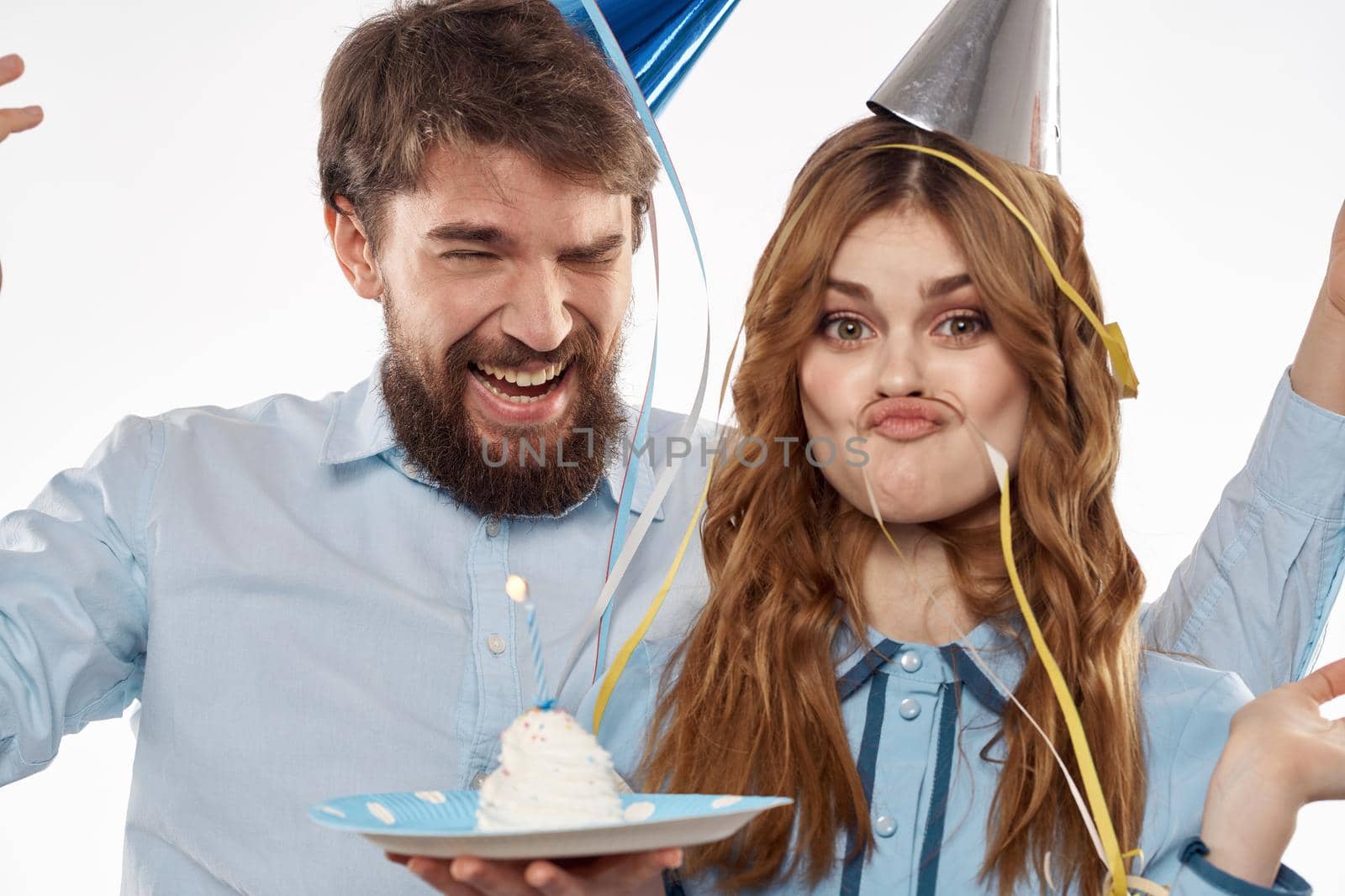 funny man and woman holiday birthday surprise fun light background. High quality photo