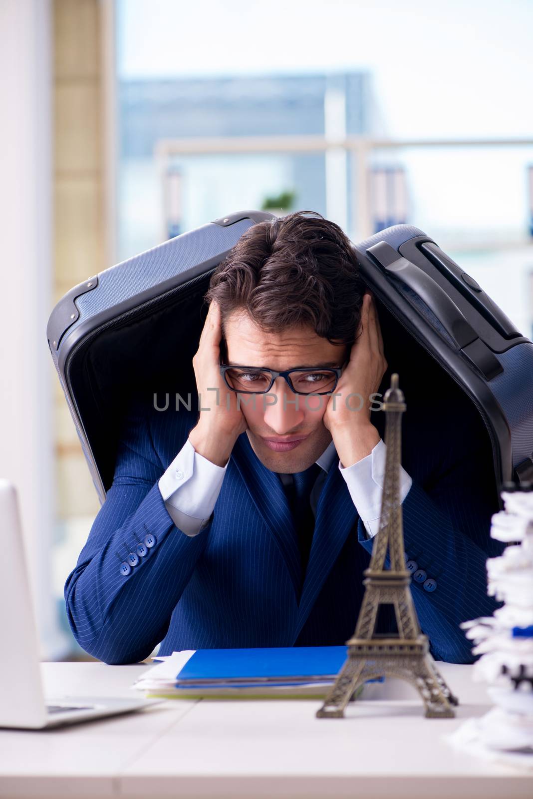 Employee thinking of vacation due to excessive workload