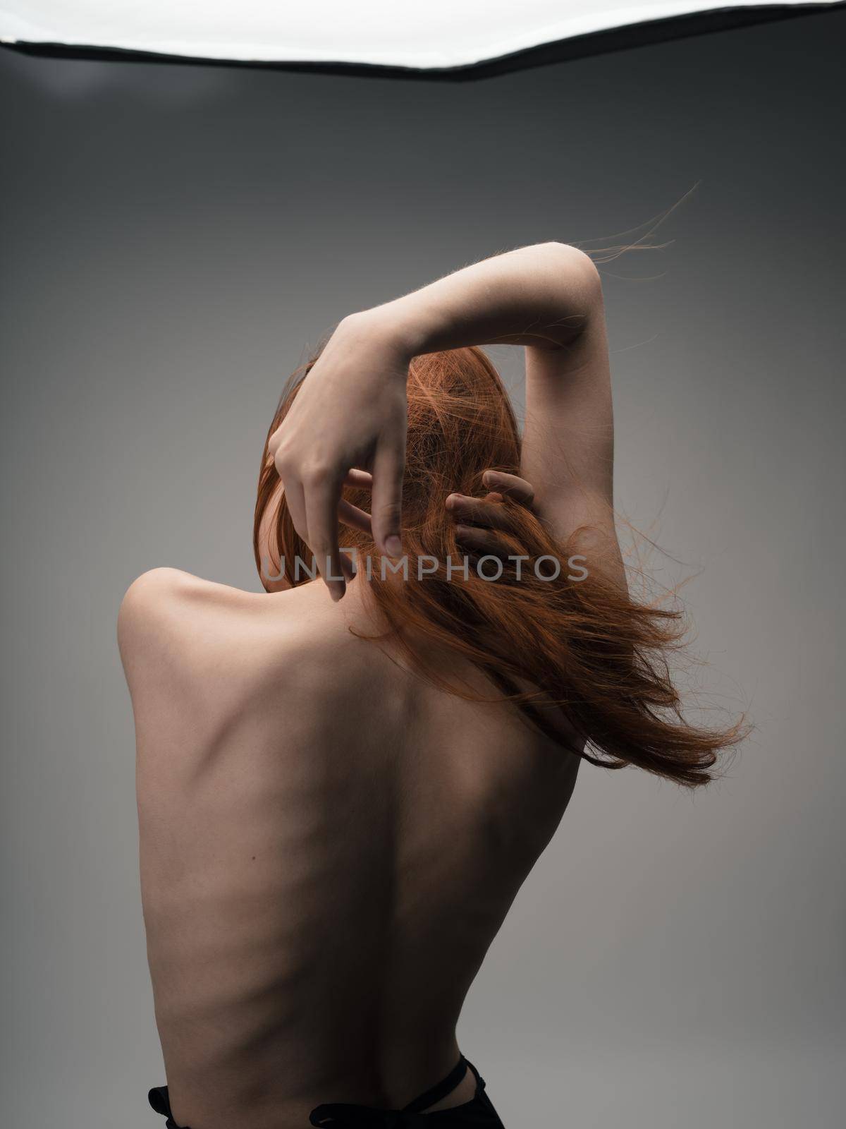 Nude red-haired woman touching herself with hands cropped back view by SHOTPRIME