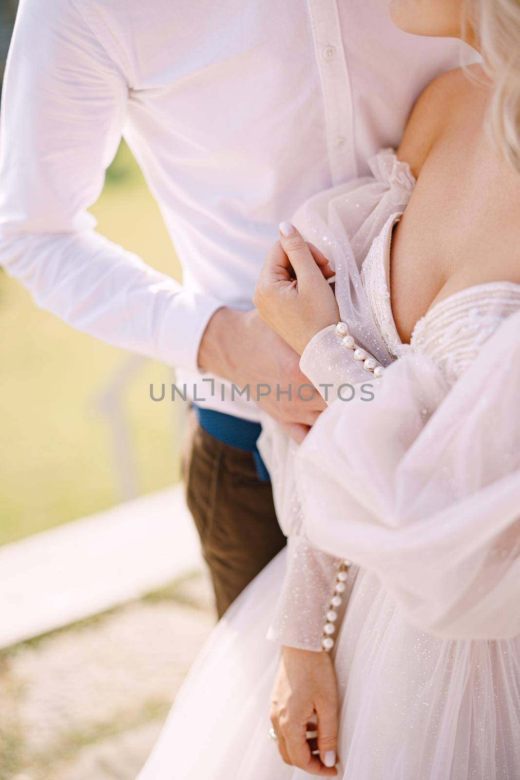 Wedding couple in the garden at sunset. Wedding in Florence, Italy, in an old villa-winery.