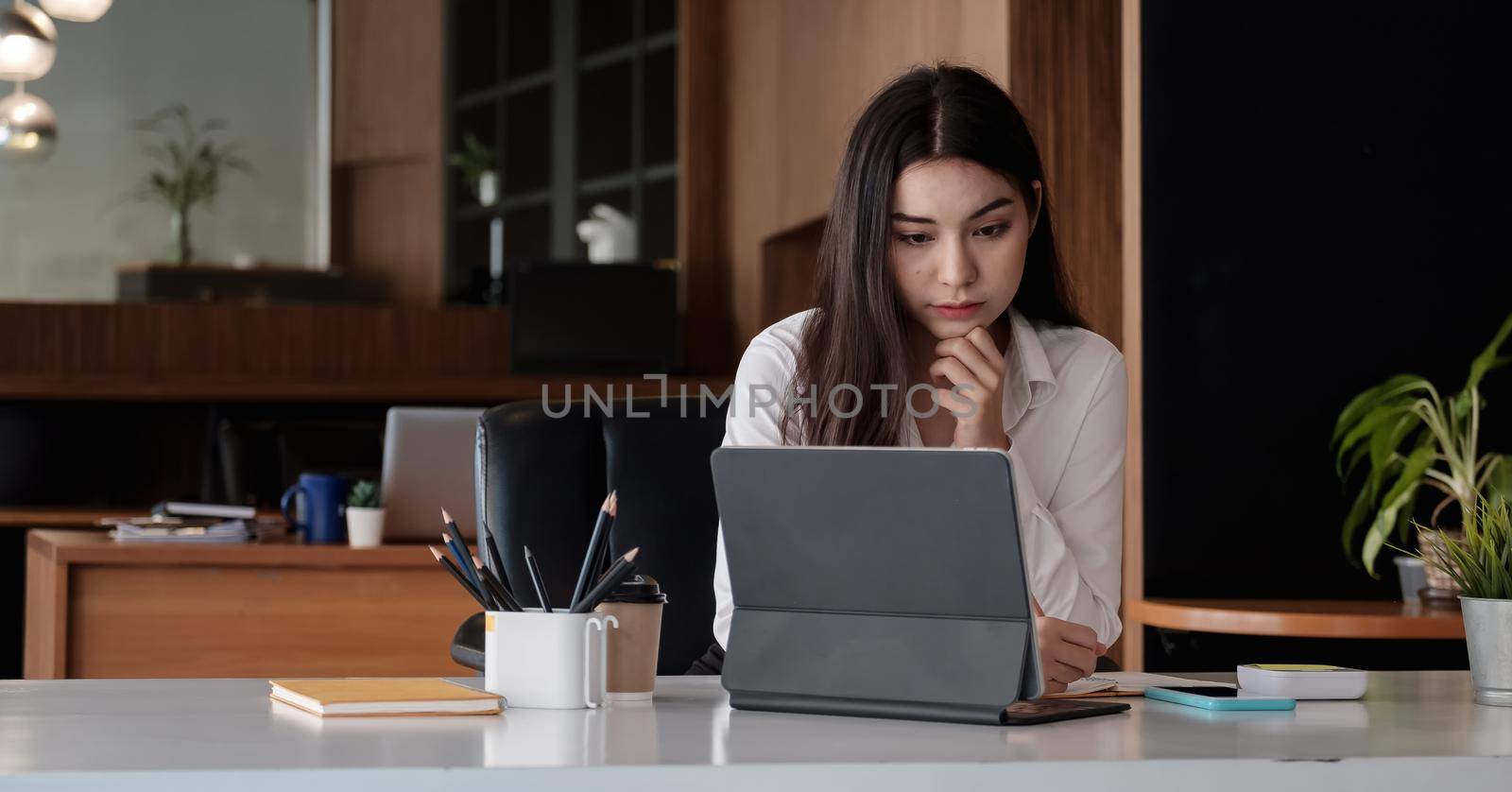 Shot of Business woman using laptop analysis with business data at her office