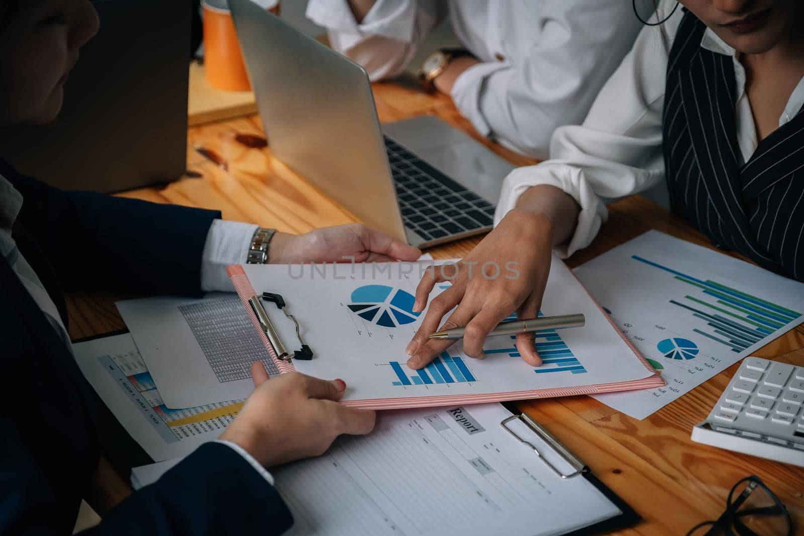 Shot of Business team working new startup project and discussing the charts and graphs showing the results at meeting accounting and financial