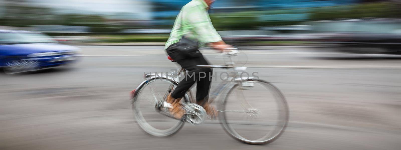 people on bicycle in the city roadway by palinchak