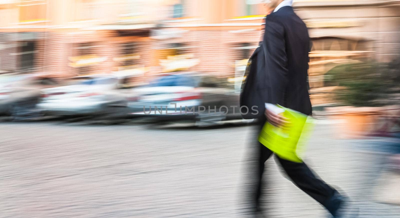 Soft focus blurred abstract image of business people in the street. Intentional motion blur