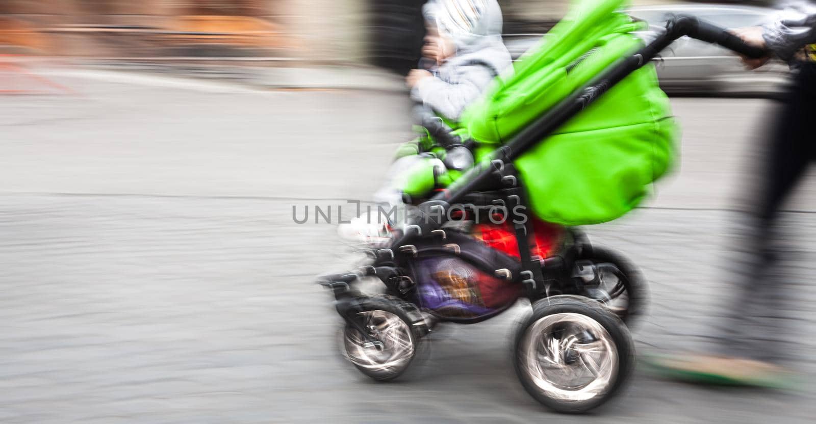 Mother with small children and a pram by palinchak