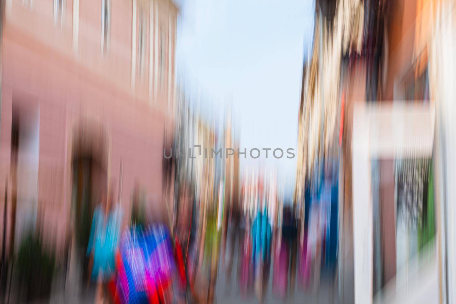 Urban city life background. Motion blur image of crowd of people walking on busy city street