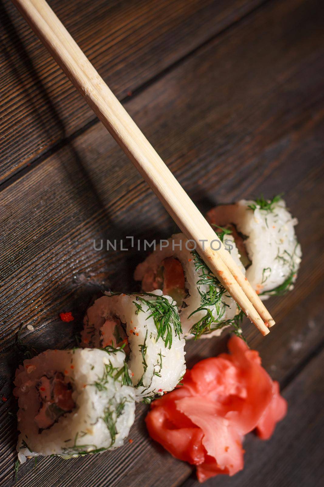 rolls red ginger food delivery japanese restaurant gourmet wooden table. High quality photo