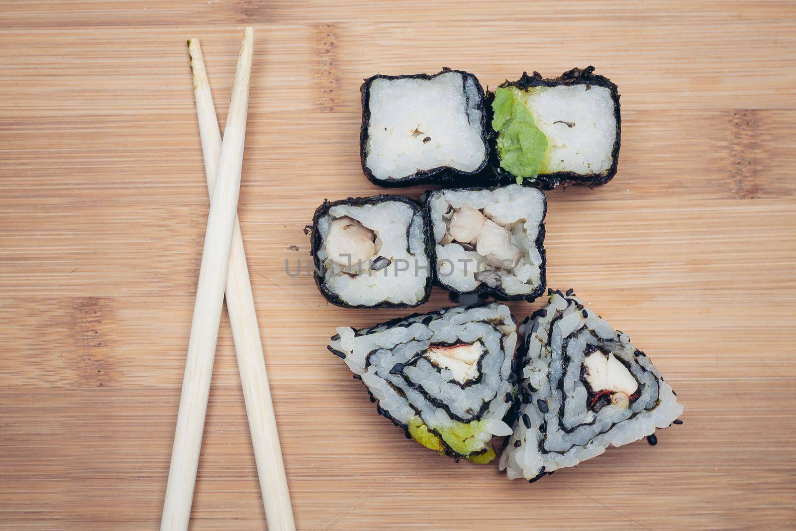 japanese cuisine sushi rolls traditional food chopsticks. High quality photo