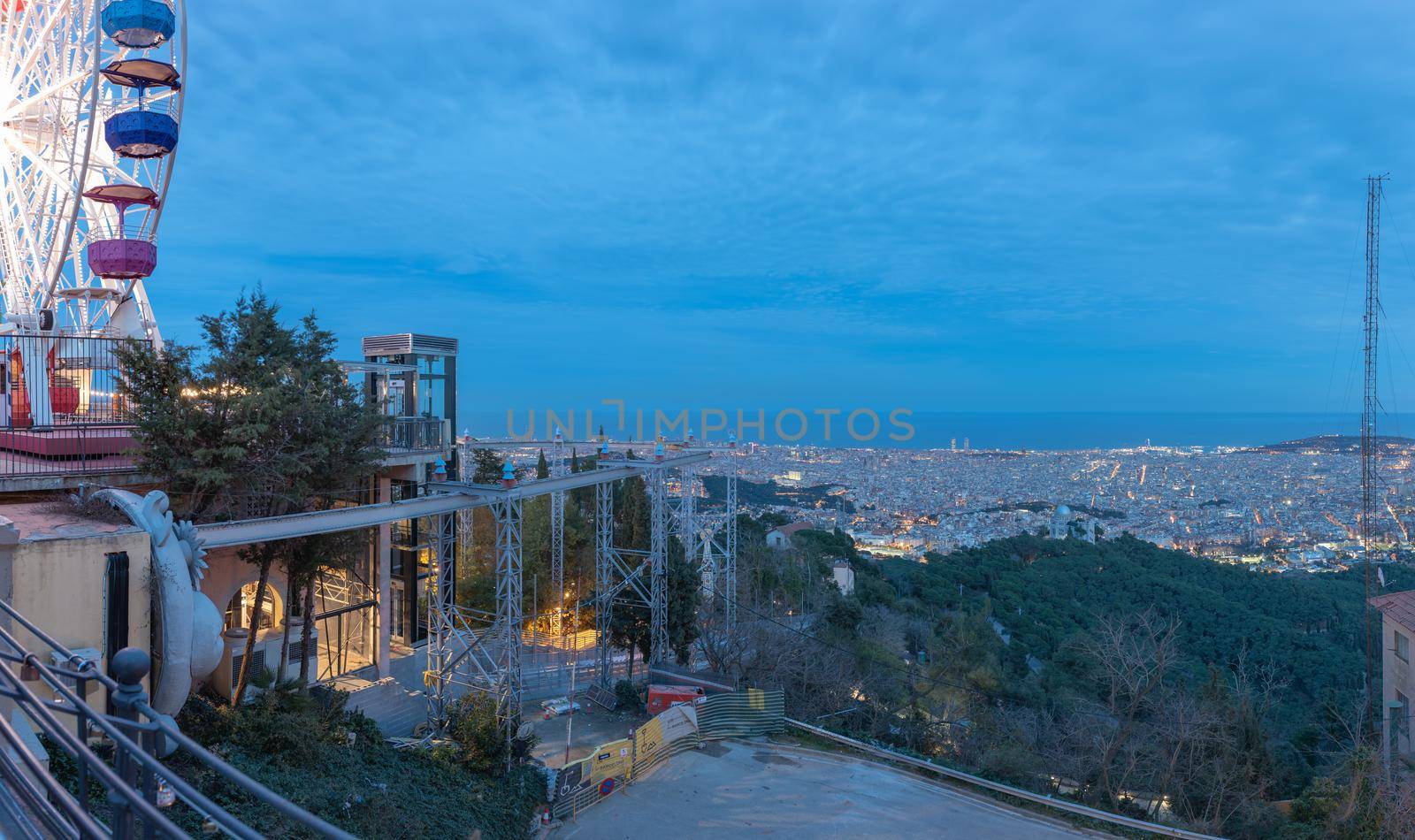 Barceloan, Spain : 2021 February 11 : Wheel of minions over the city, in Tibidabo, Barcelona in 2021.