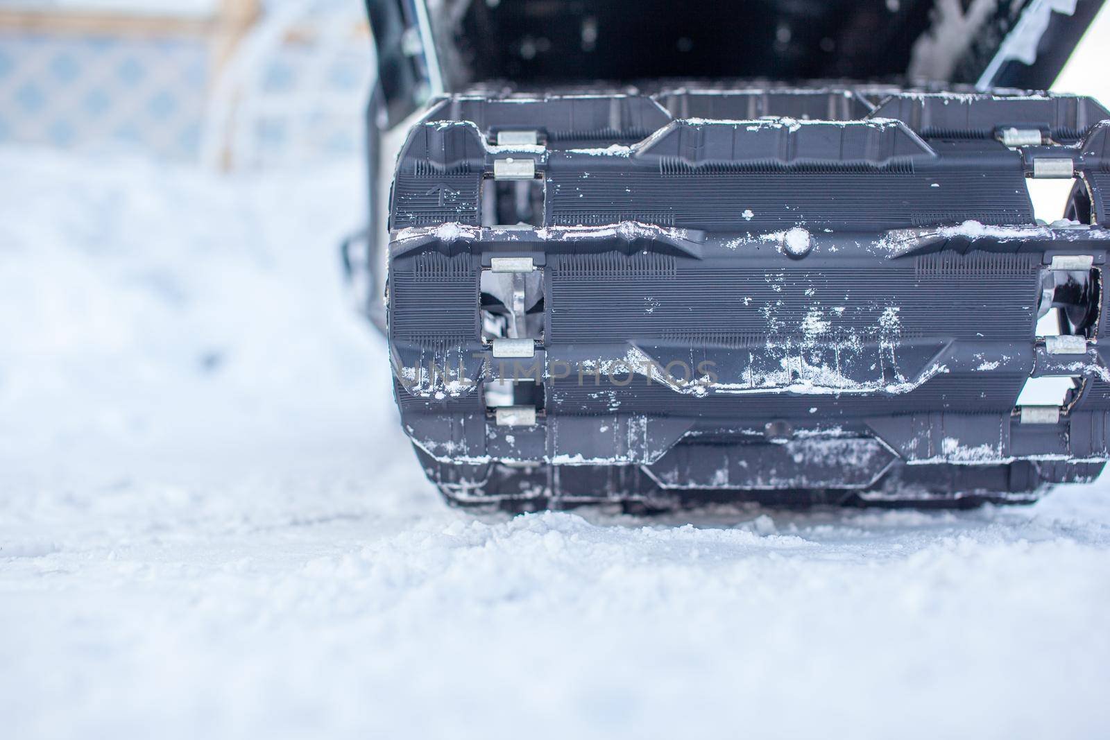 Rear suspension of a snowmobile in winter. Riding in the snow by AnatoliiFoto