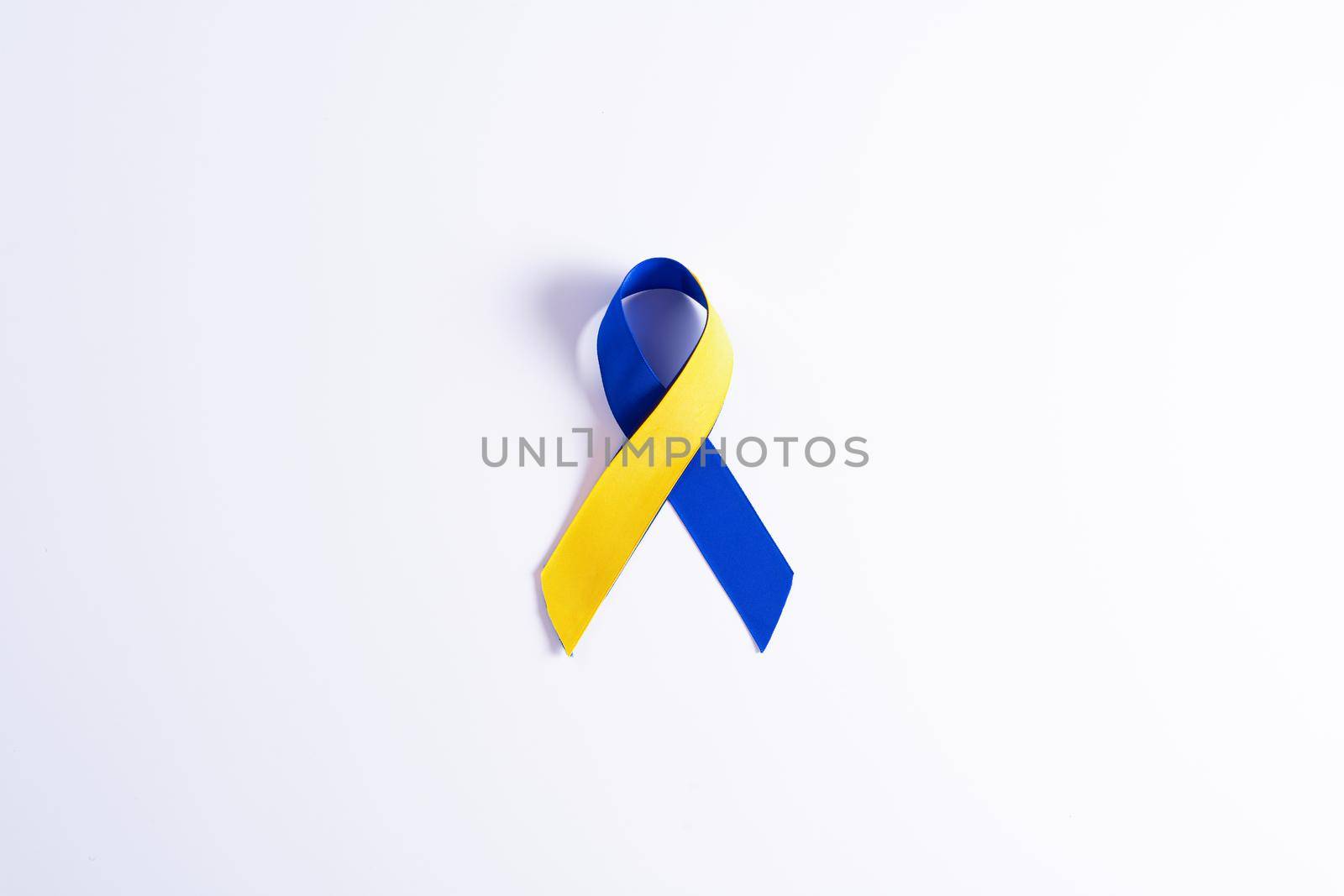 Down syndrome day with blue yellow ribbon awareness support patient with illness disability