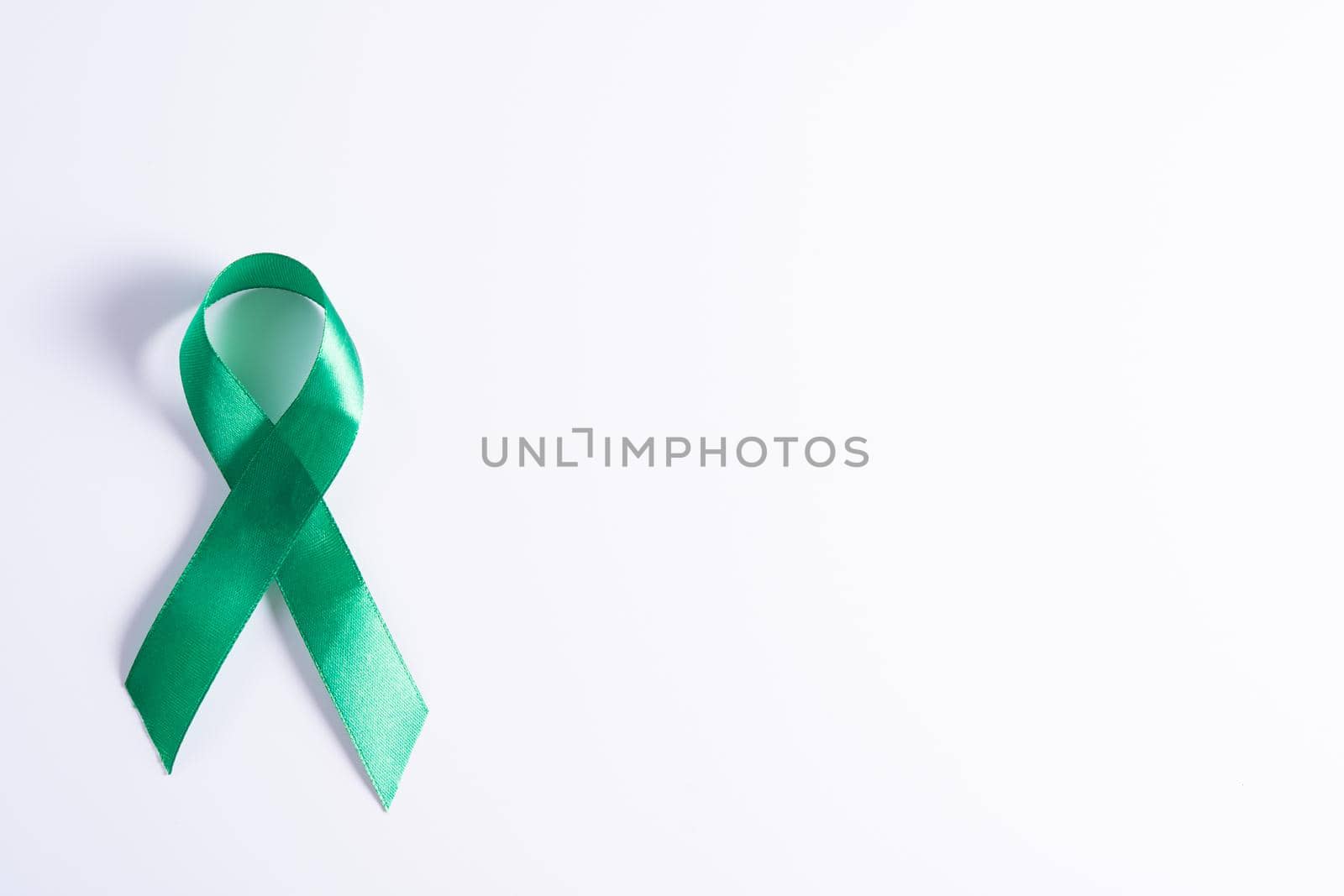 World kidney day, green ribbon awareness of kidney disease isolated white background. by mikesaran